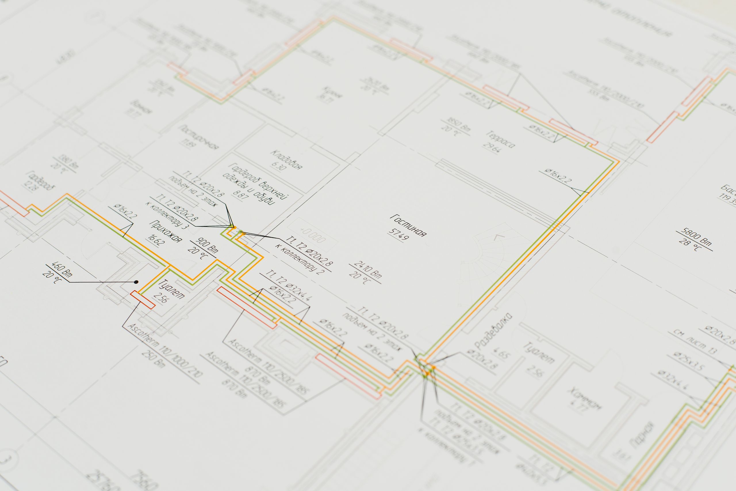 Close-up of a detailed architectural blueprint showing design plans on a desk. Ideal for construction and design concepts.
